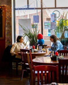 Two people sit for breakfast at Gillie's