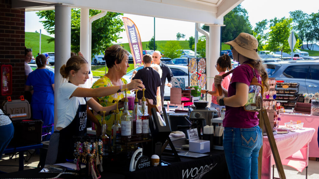 A shopper and vendor speak at the Farmers Market
