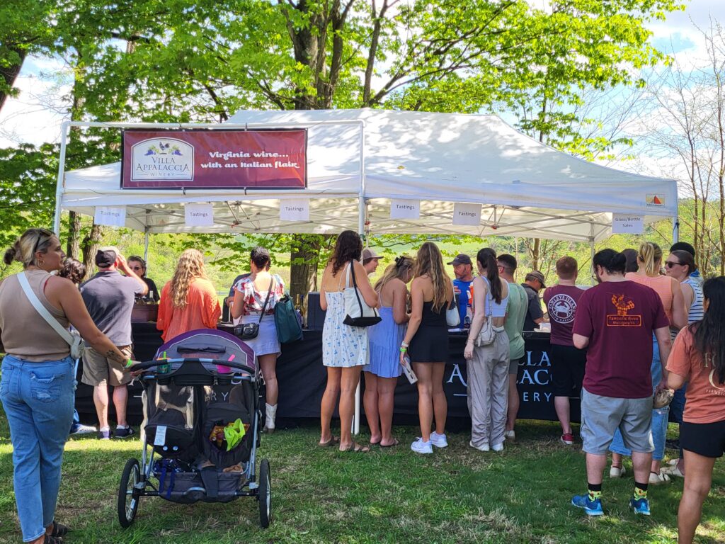 Blacksburg Fork and Cork Attendees hang out under a wine tent