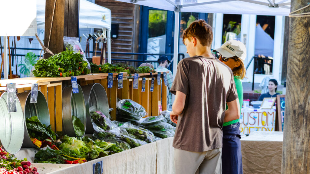 Mother and son shop at the Blacksburg Farmers Market